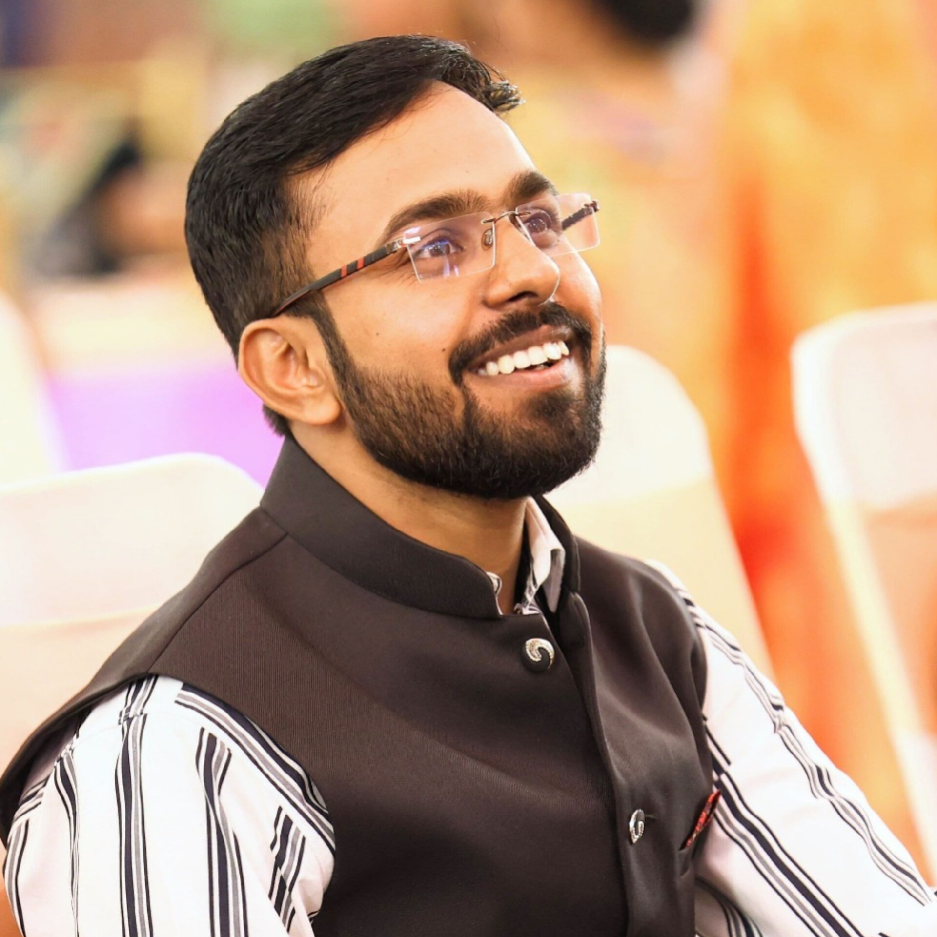 Professional portrait of Dr. Rajesh Kumar, a middle-aged male counselor wearing a suit, smiling warmly in a well-lit office environment